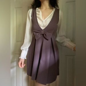 Iris purple pleated mini dress with bow pinafore